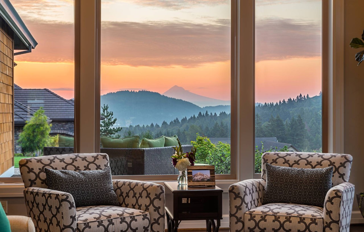 A large picture window with a view of the sunrise at Blind Scapes near Albuquerque, NM
